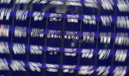 Ações da China fecham em baixa com dados do PIB abaixo do esperado
