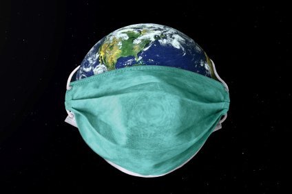 Máscara em torno do planeta terra sob coronavírus