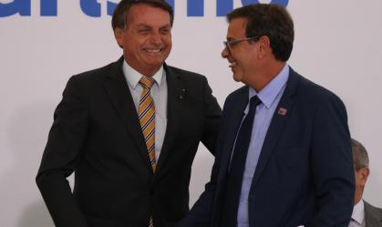 O presidente Jair Bolsonaro e o presidente da Embratur Gilson Machado