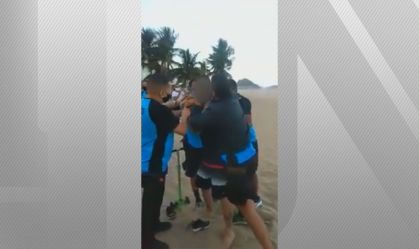 Guardas usam arma de choque contra homem sem máscara em praia no RJ
