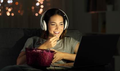 Single,Woman,Watching,Online,Tv,In,The,Night,Sitting,On