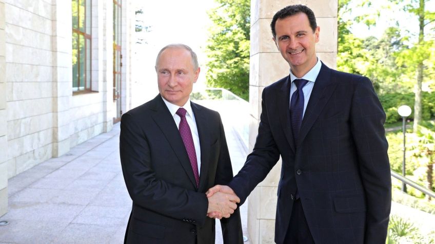 Presidentes Vladimir Putin, da Rússia, e Bashar Al-Asad, da Síria • Imprensa do Kremlin/Anadolu Agency/Getty Images