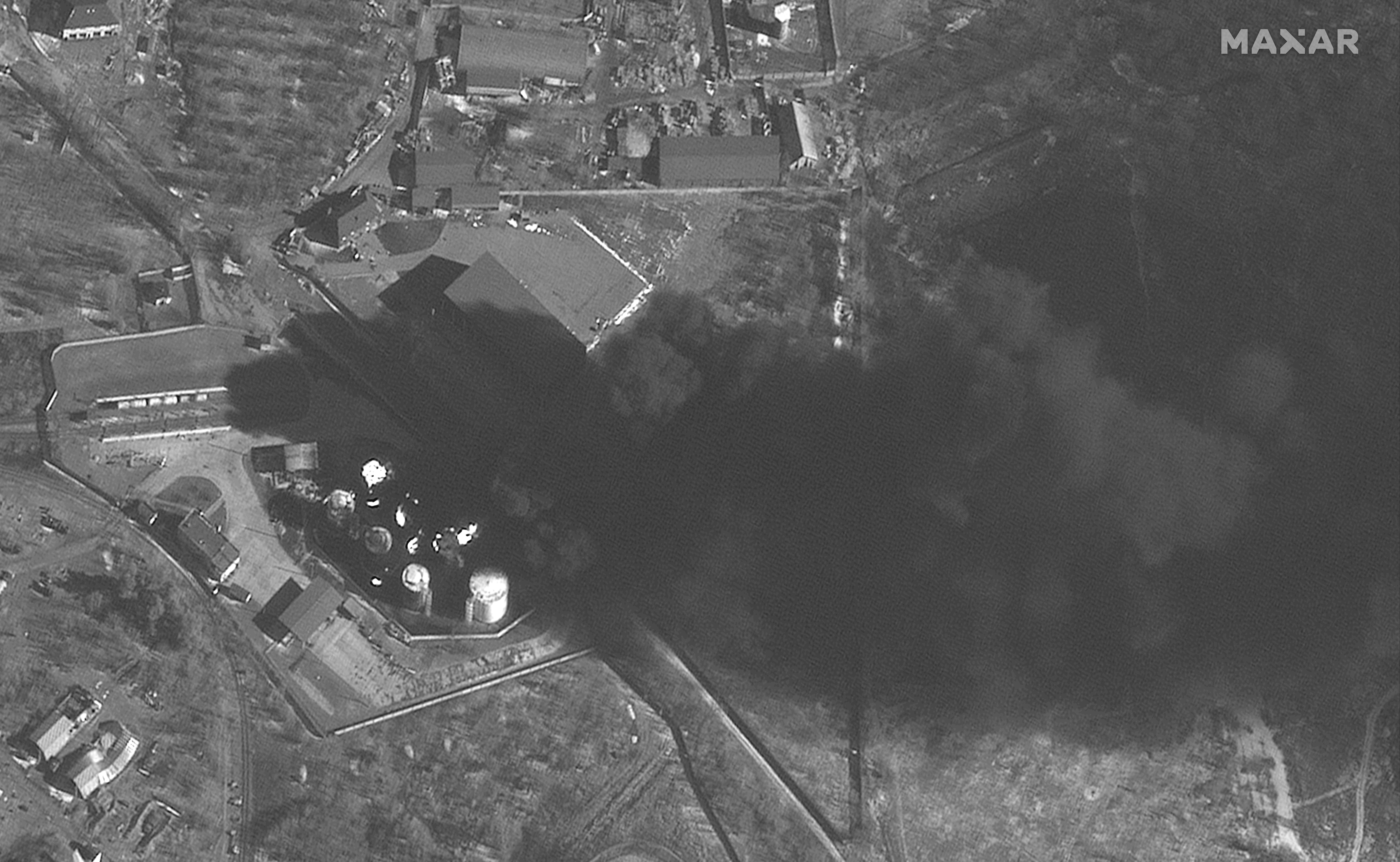 RUSSIANS INVADE UKRAINE -- MARCH 10, 2022:  02 Maxar satellite imagery of fires at fuel storage area_antonov airport_afternoon collection in Hostomel, Ukraine. 10march2022_wv1.   Please use: Satellite image (c) 2022 Maxar Technologies.