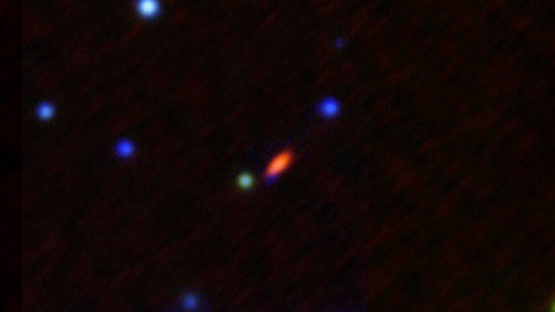 Esta imagem, capturada pelo Very Large Array Karl G. Jansky, mostra o objeto FRB 190520 quando está ativo (em vermelho). / NRAO/AUI/NSF
