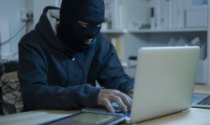 Hacker is Using Computer