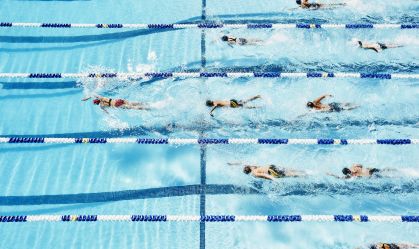 Swimmer leading group of competitive swimmers
