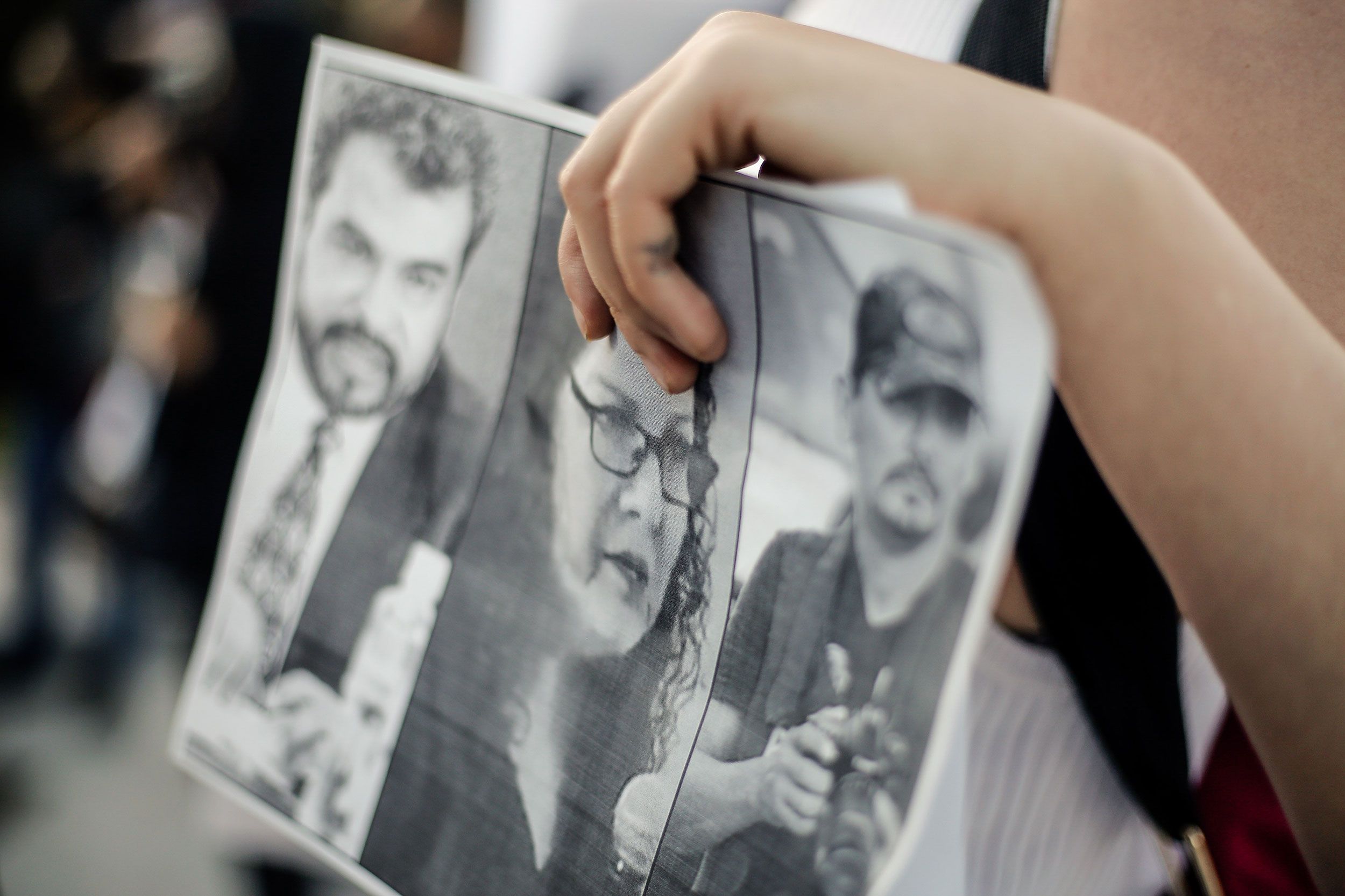 A protester holds a placard during a demonstration against