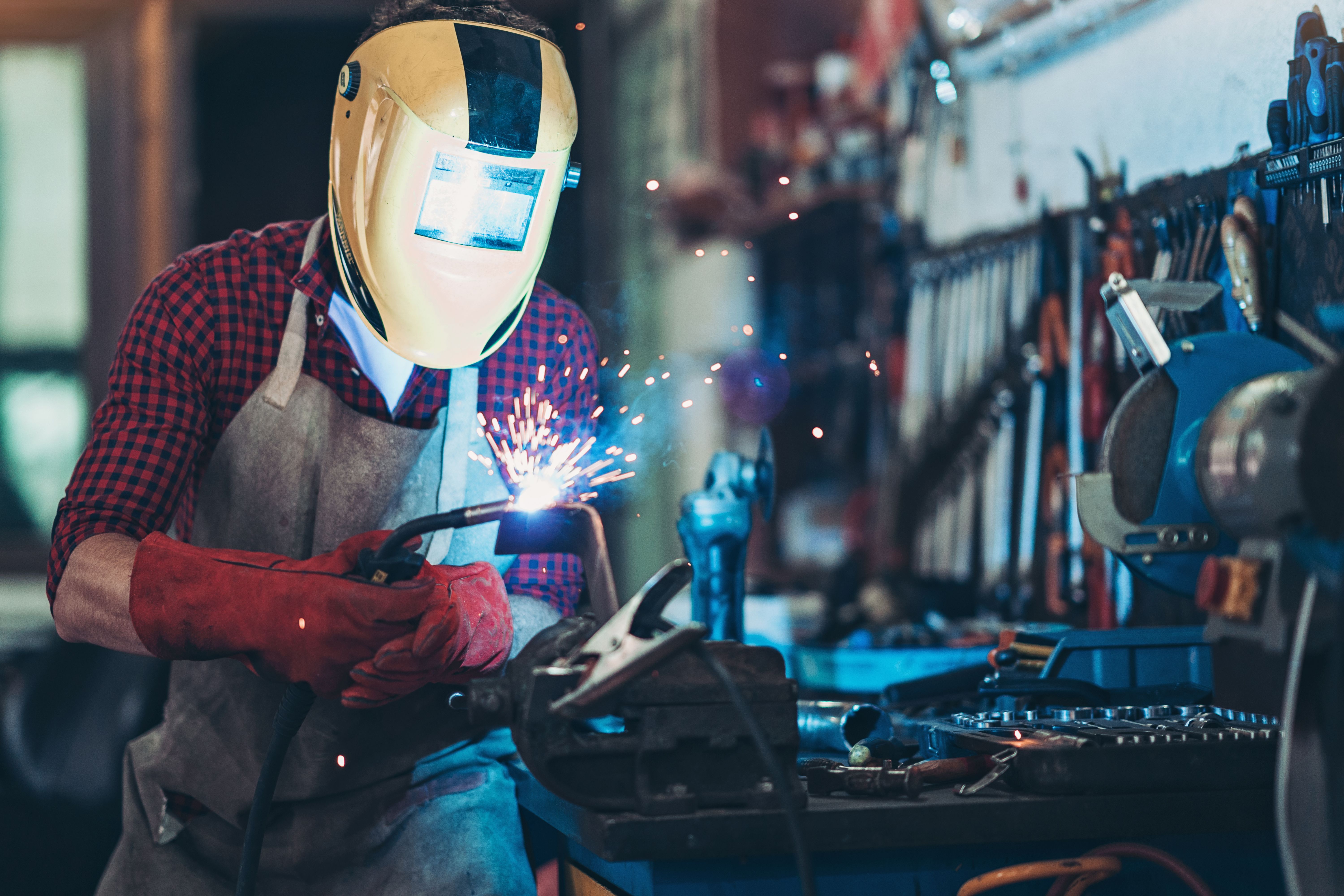 Mechanic using a welding torch