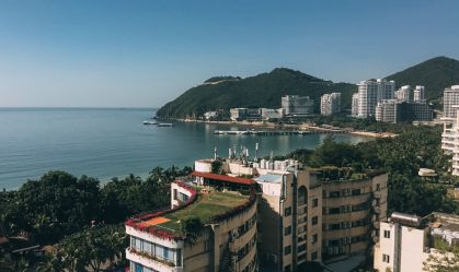 High Angle View Of Buildings And Sea Against Clear Sky