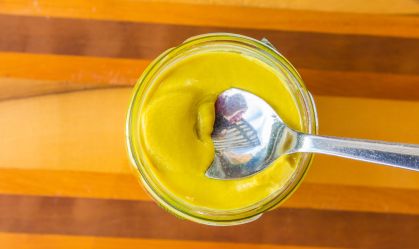 French Mustard Pot On Warm Wood Background Shot From Above