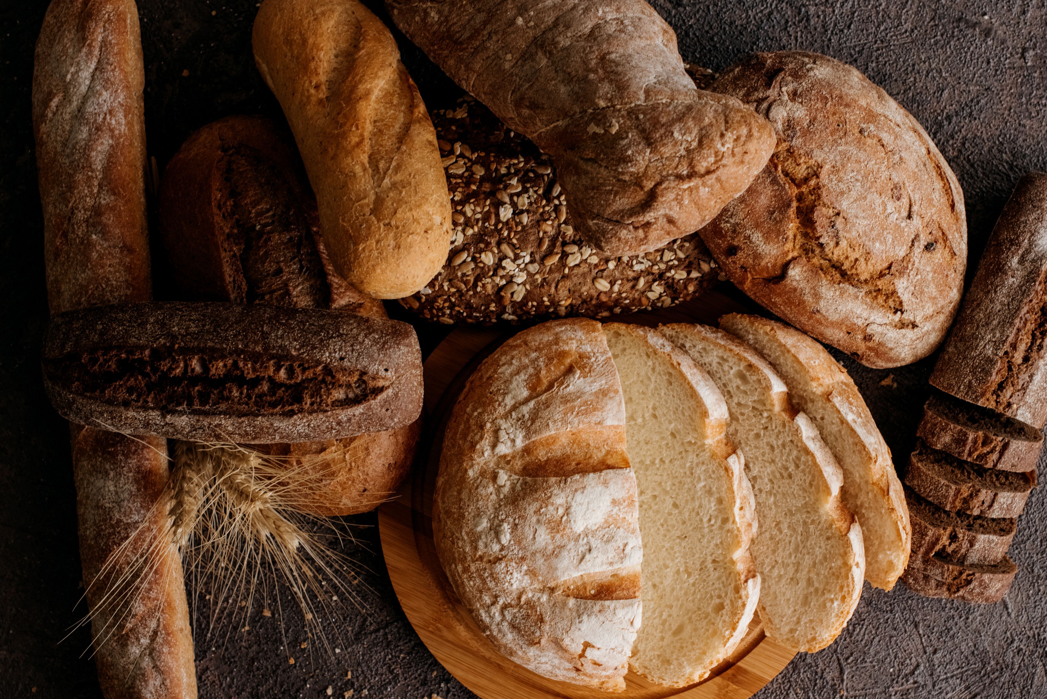 Freshly baked traditional bread on wooden table