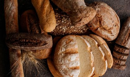 Freshly baked traditional bread on wooden table