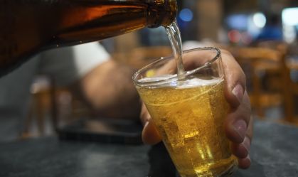 Pouring a beer in a Rio de Janeiro bar.