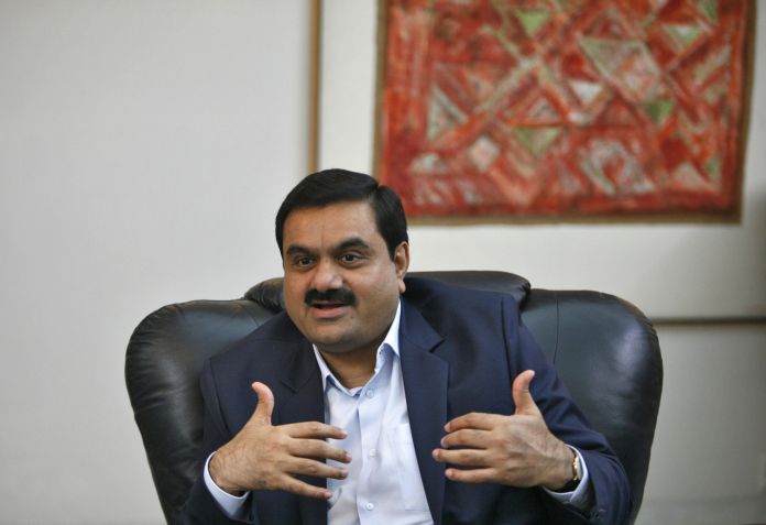 FILE PHOTO: Indian billionaire Gautam Adani speaks during an interview in the western Indian city of Ahmedabad September 24, 2012. REUTERS/Amit Dave / REUTERS/Amit Dave