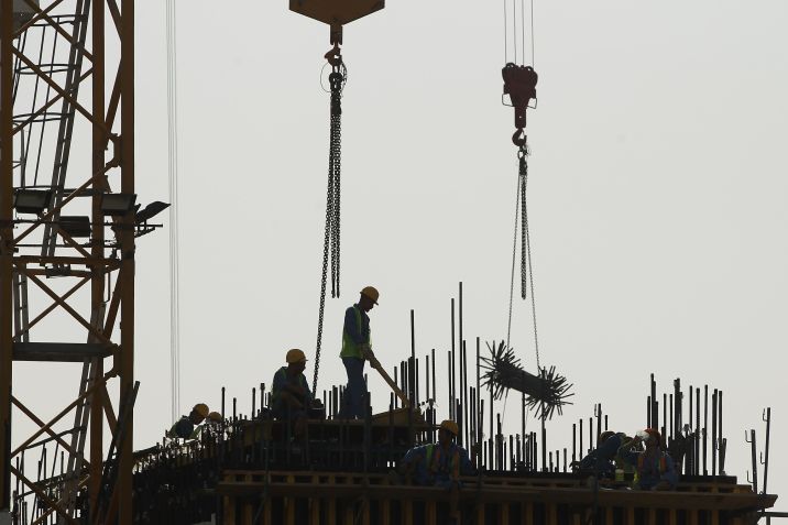 Trabalhadores em Doha, no Catar, em 2011 / Photo by Sean Gallup/Getty Images