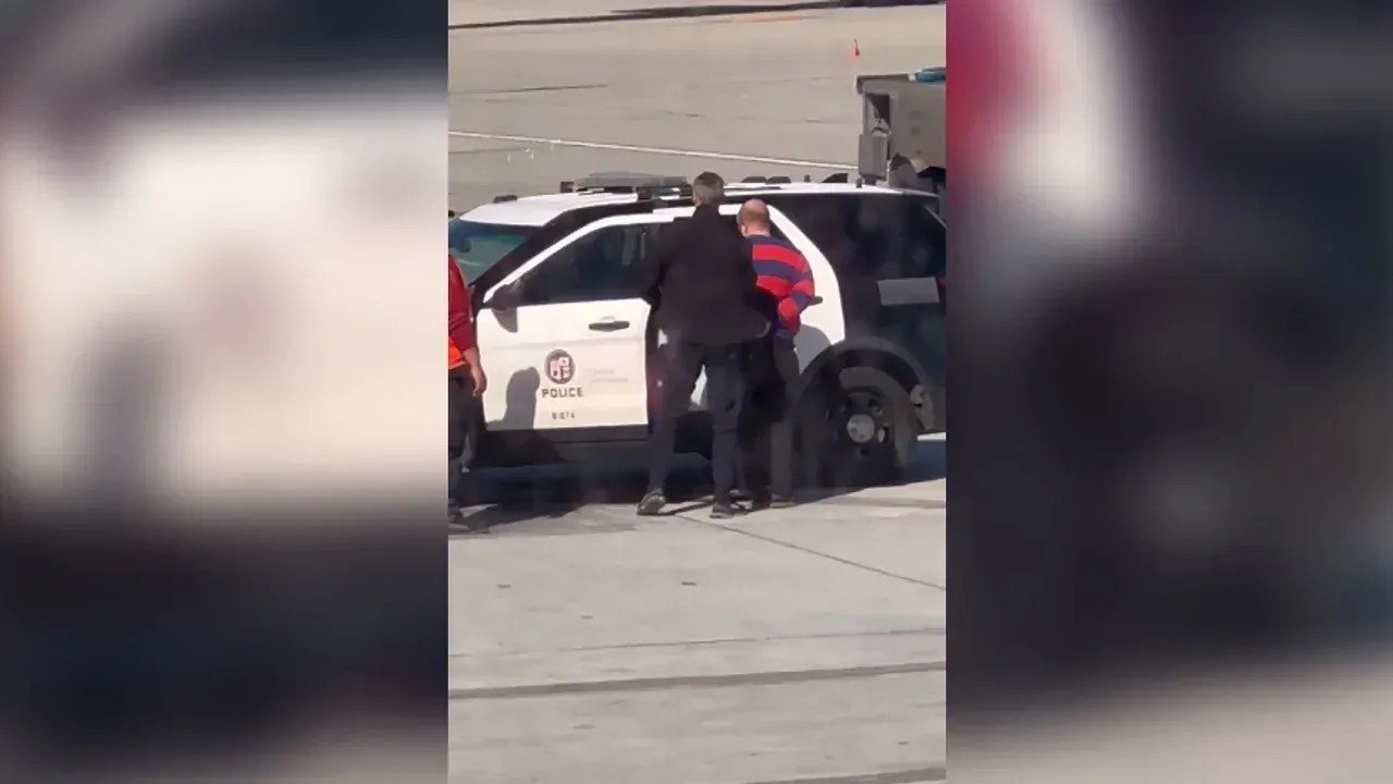 230326173933-lax-passenger-open-door-still