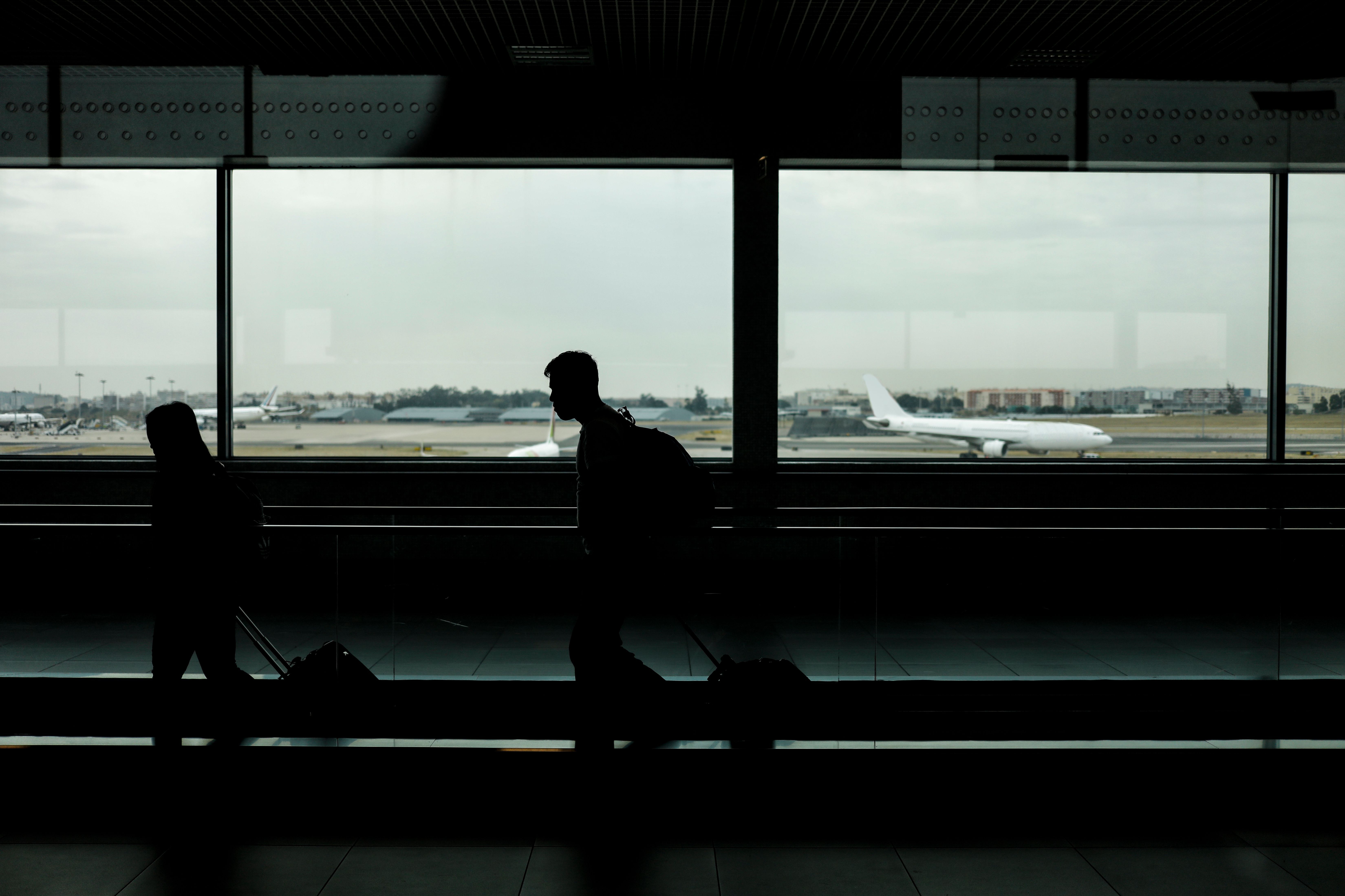 Silhouette People Walking At Airport