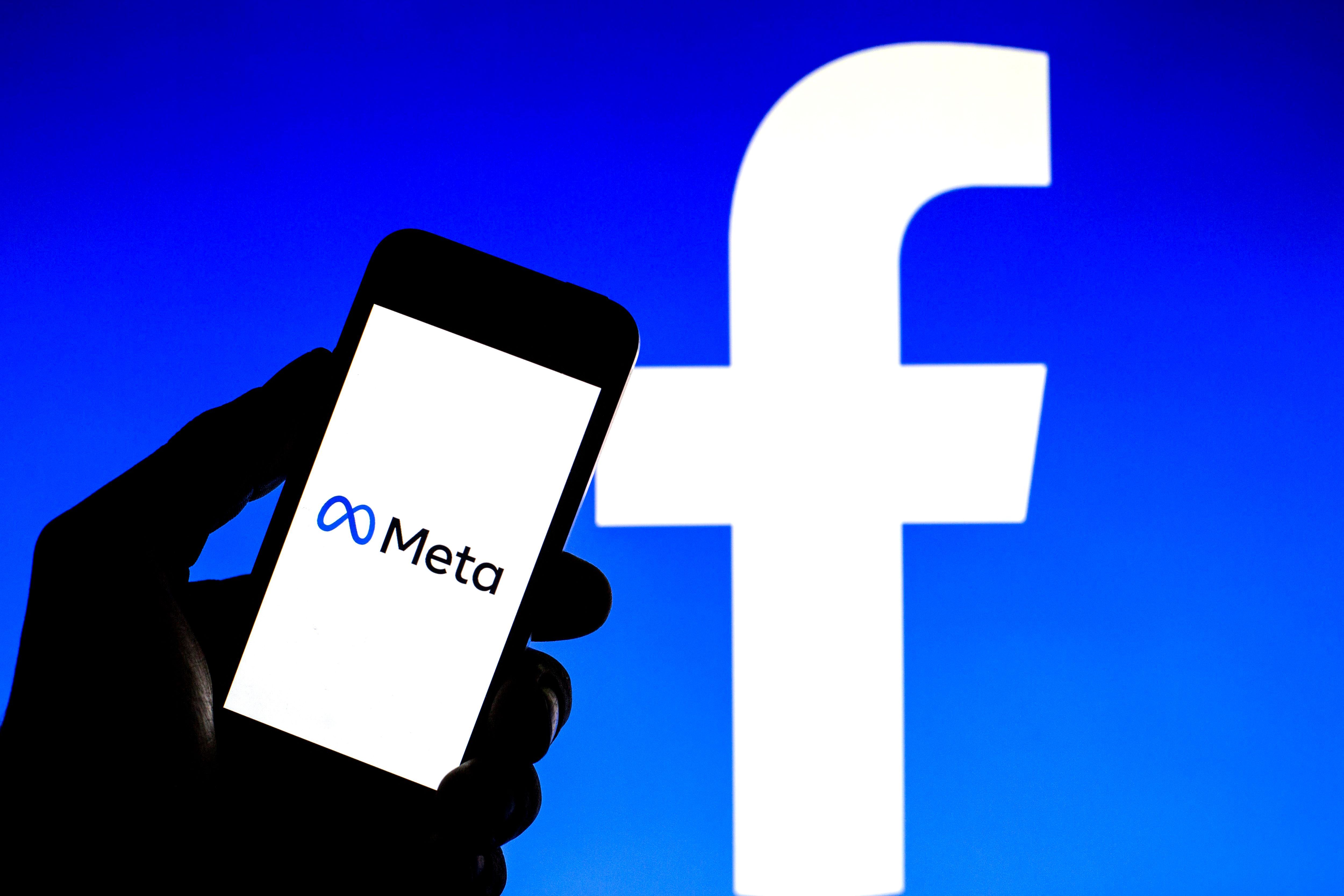 In this photo illustration a Meta logo seen displayed on a