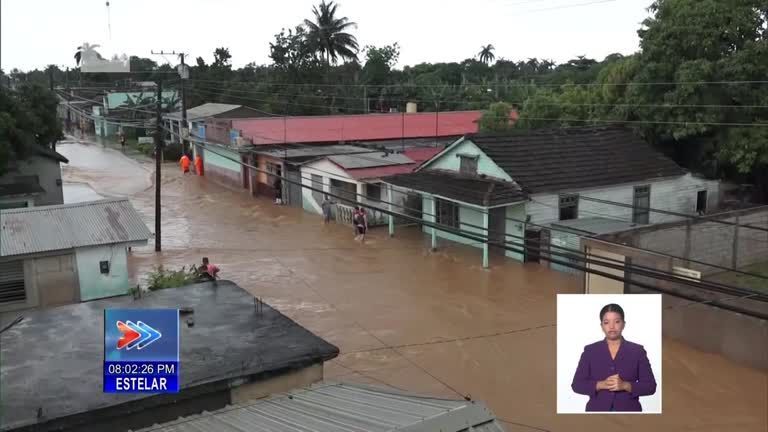 One dead and thousands evacuated as floods batter Cuba