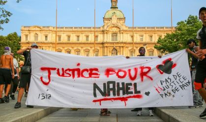 Demonstrators hold a banner during the demonstration