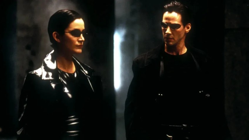 Carrie-Anne Moss e Keanu Reeves em "The Matrix", de 1999 / Jasin Boland/Warner Bros/Village/Shutterstock