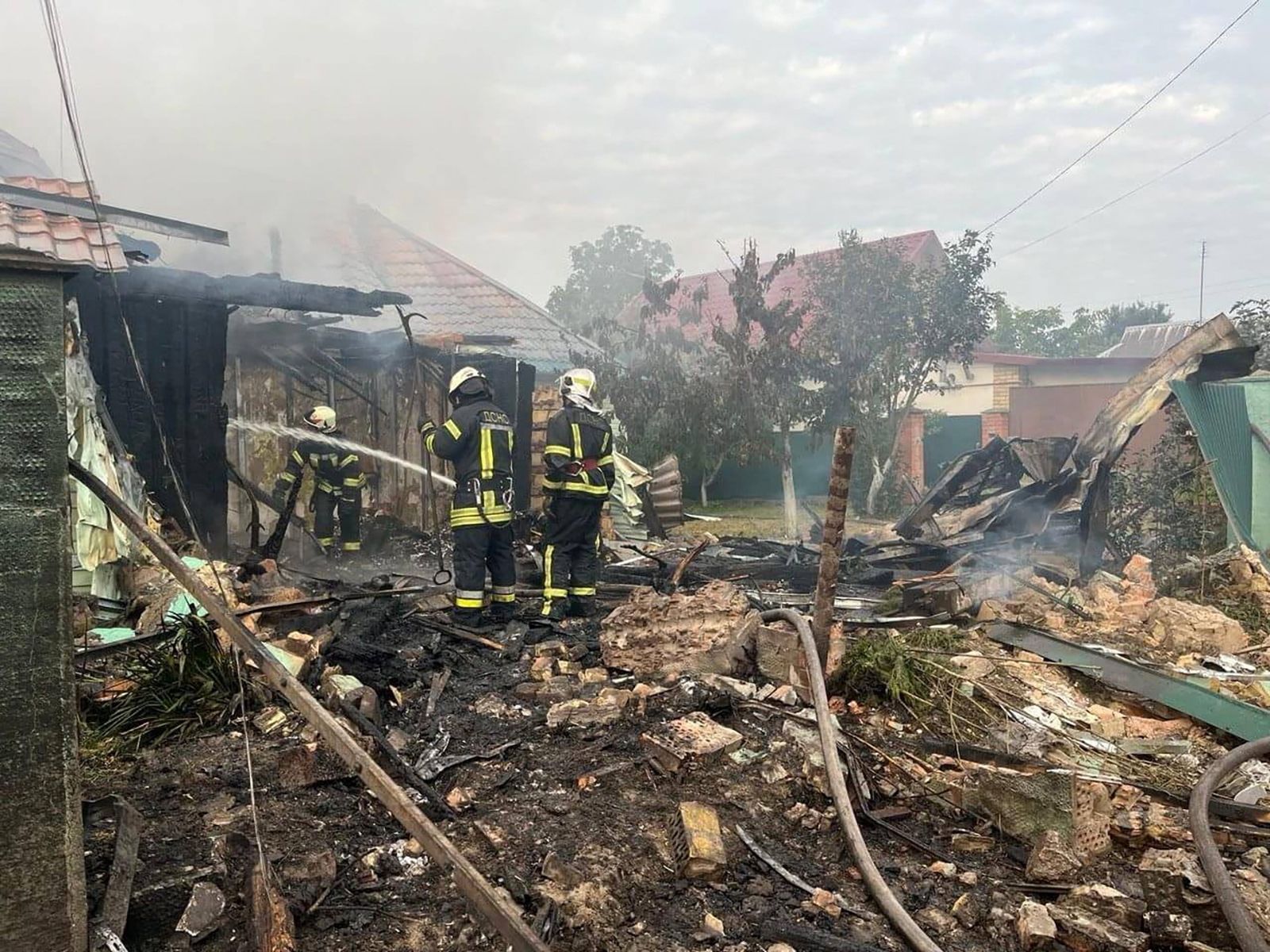 Rescuers work at a site of building damaged in the night by Russian drone and missiles strike in Kyiv