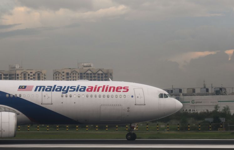Avião da Malaysia Airlines no Aeroporto Internacional Manila Ninoy Aquino, em julho de 2019, nas Filipinas / Photo by Artur Widak/NurPhoto via Getty Images