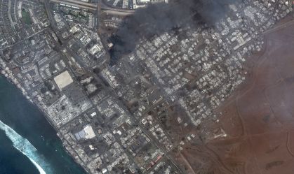 WILDFIRE LAHAINA, MAUI, HAWAII -- AUGUST 9, 2023:  04 Maxar satellite imagery showing total destruction of the Lahaina square and outlets after the Lahaina Wildfire, with one building still actively burning.  Please use: Satellite image (c) 2023 Maxar Tech