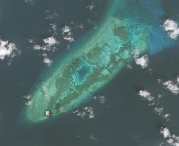 Imagens de satélite Maxar do Fiery Cross Reef no Mar da China Meridional, uma parte do grupo de Ilhas Spratly, em 2009 / Getty Images