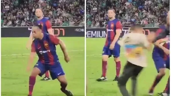 Ronaldinho Gaúcho dribla torcedor durante jogo do Barcelona Legends