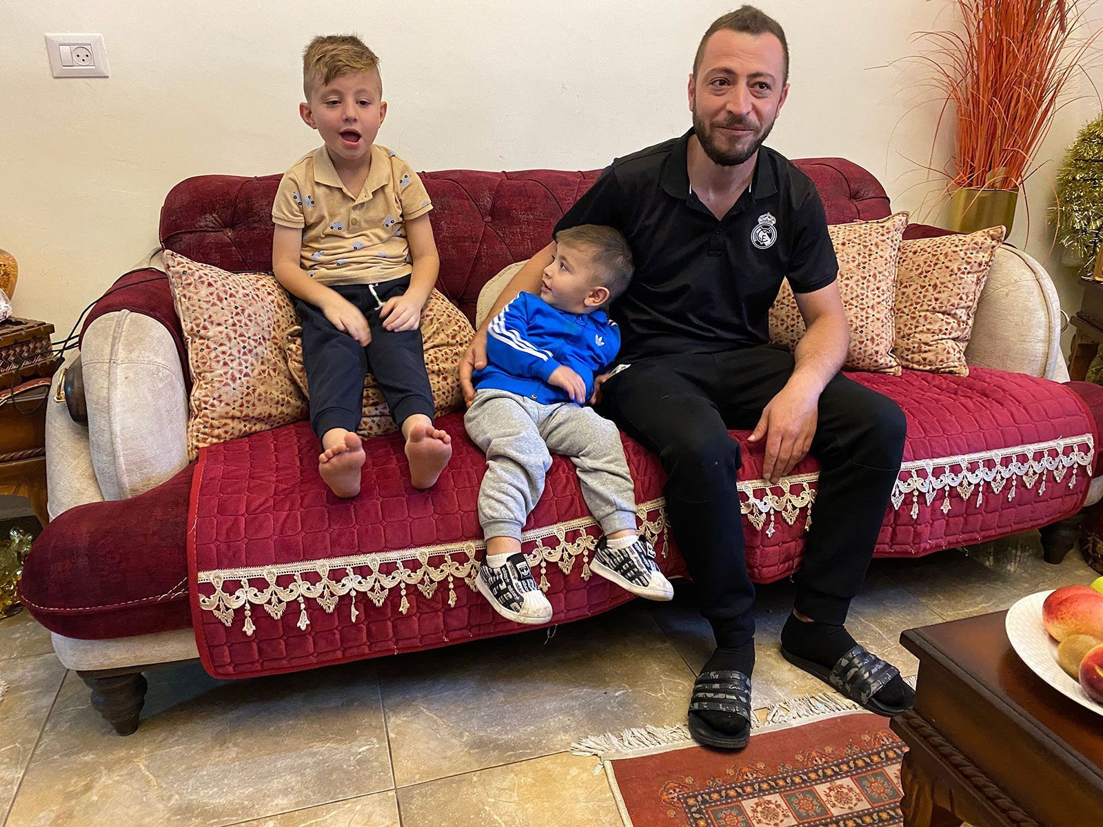 Qassem Kamal, who says his uncle was injured by Israeli police on Friday, in his home. / Ivana Kottasova/CNN