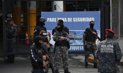 Sebin officials outside Helicoide prison during riots.