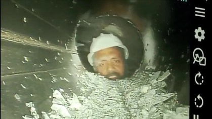 Câmera acoplada a tubo mostrou trabalhador preso em túnel, na Índia