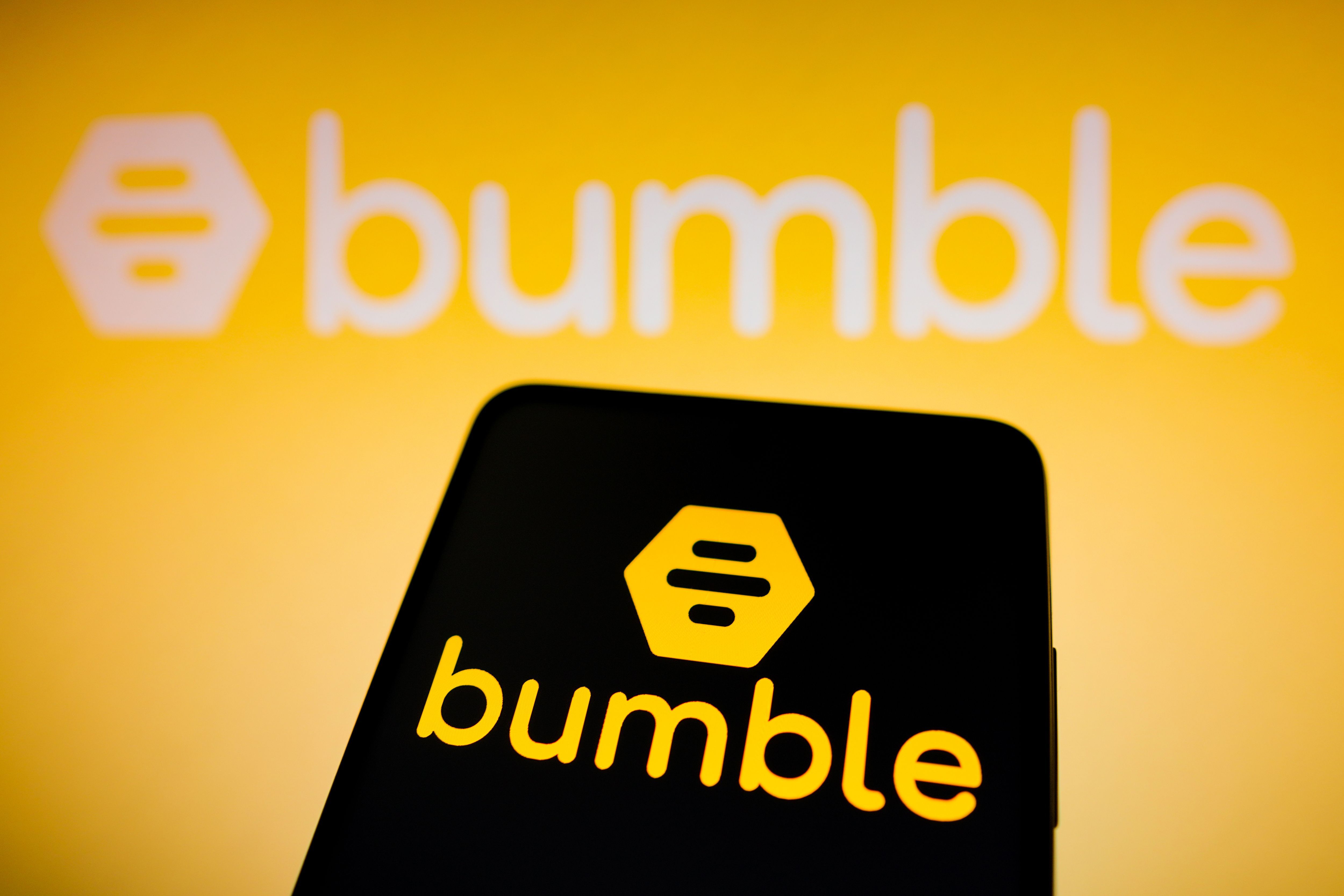 In this photo illustration the Bumble logo seen displayed on