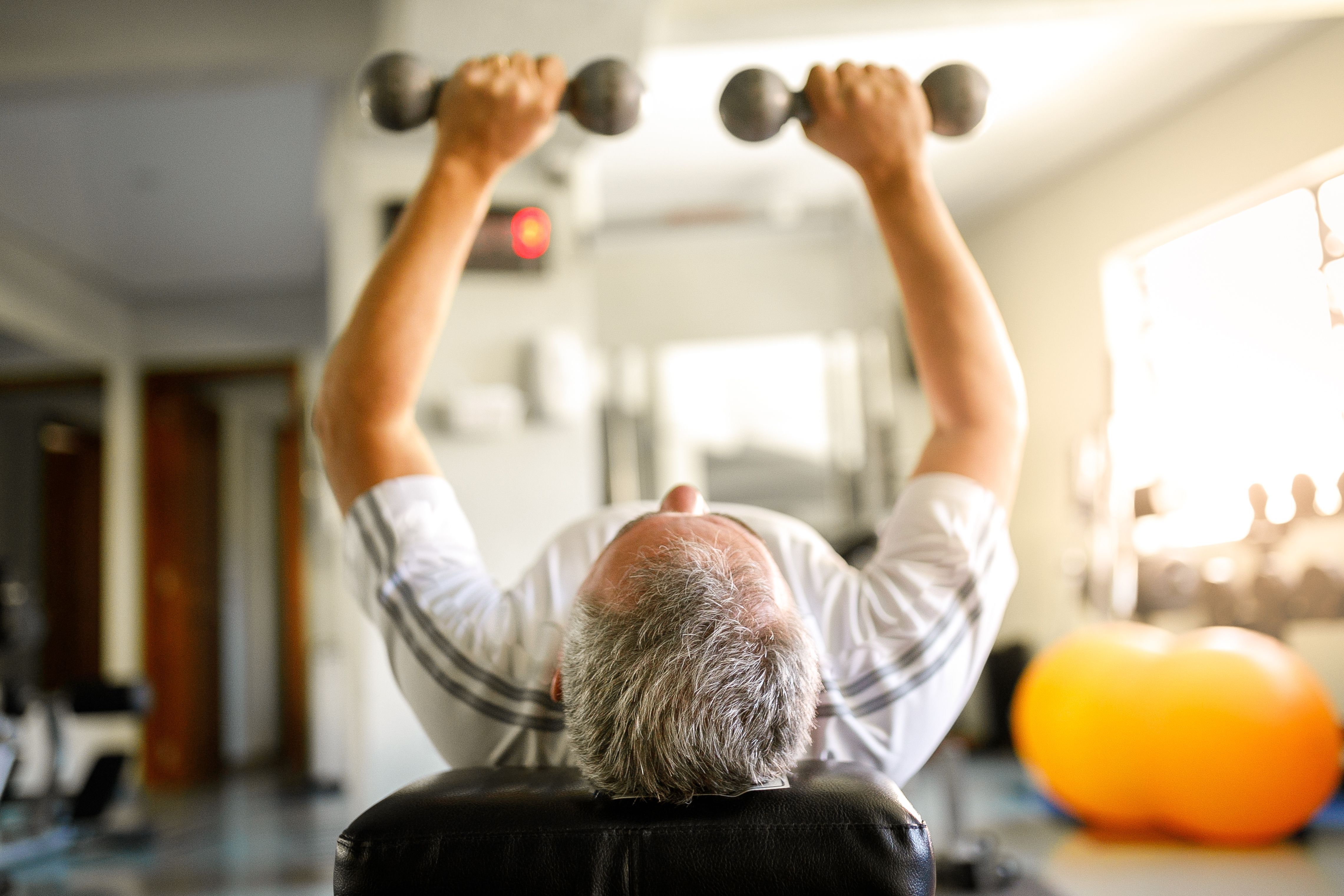 Man using dumbbells