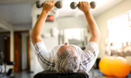 Man using dumbbells