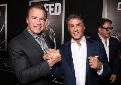 Arnold Schwarzenegger e Sylvester Stallone em streia da Warner Bros. "Creed" no Regency Village Theatre