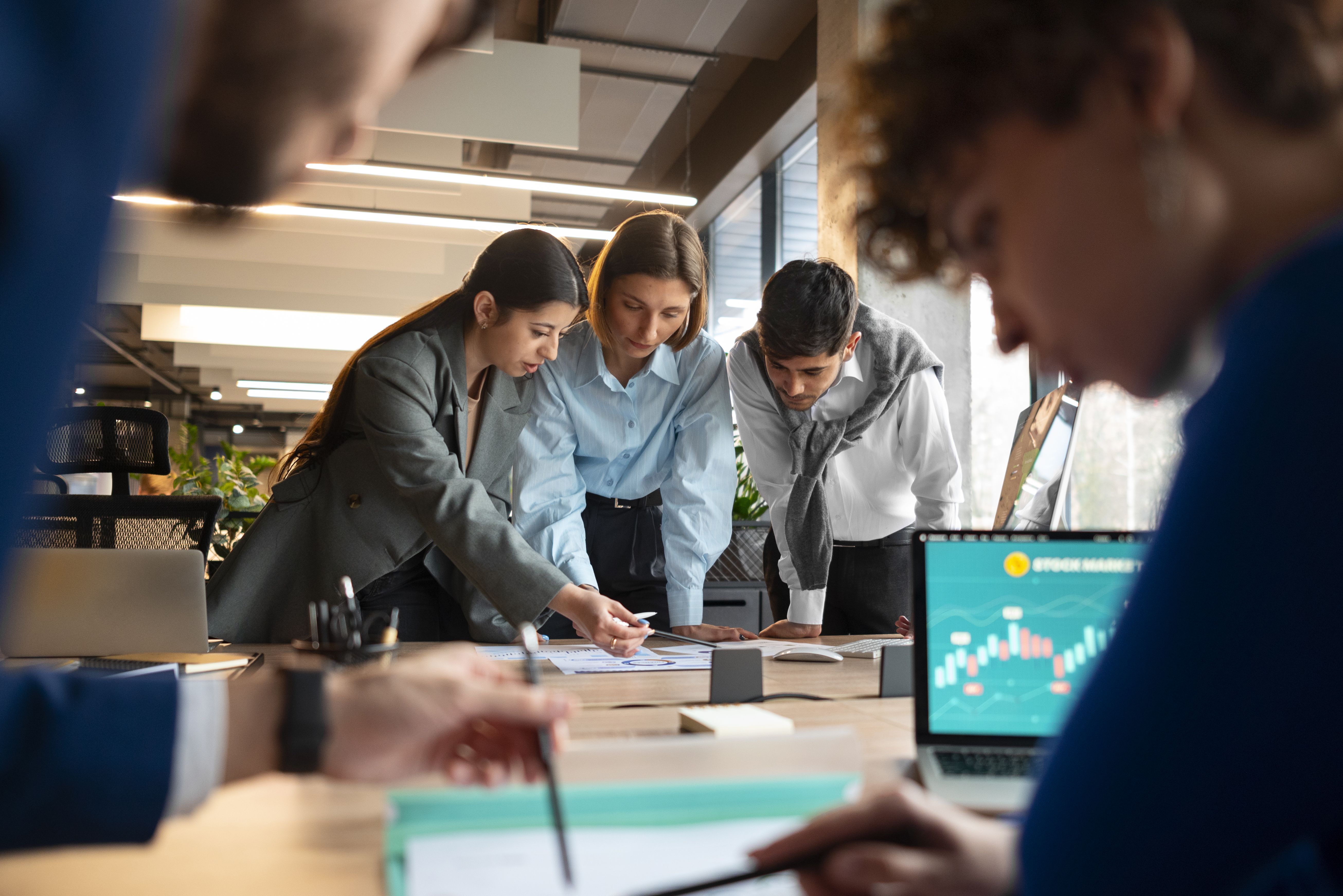 people-analyzing-checking-finance-graphs-office