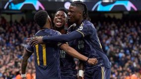 Rodrygo, Vin iJr e Camavinga comemoram o primeiro gol do Real Madrid contra o Manchester City