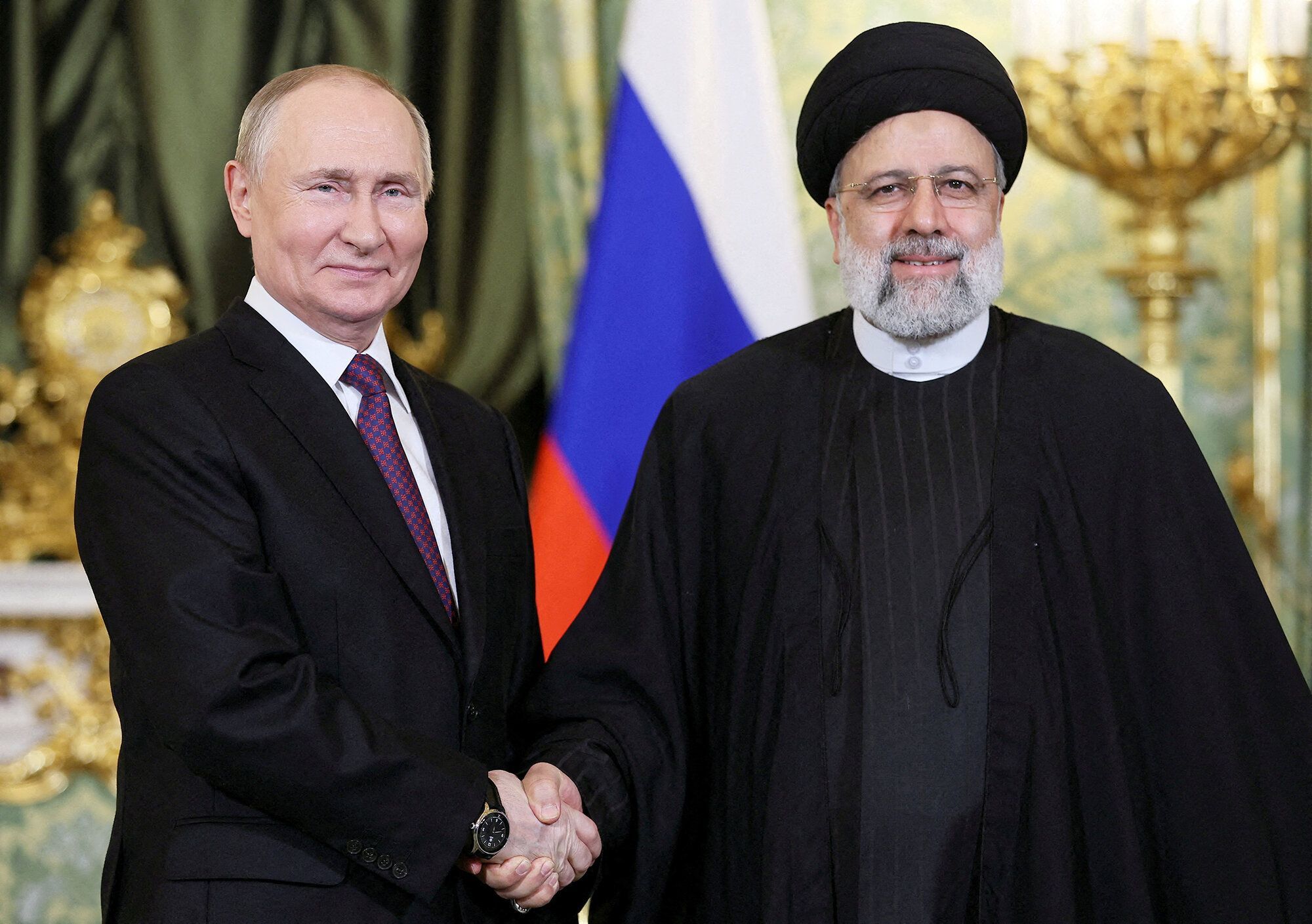 FILE PHOTO: Russian President Vladimir Putin meets with Iranian President Ebrahim Raisi in Moscow