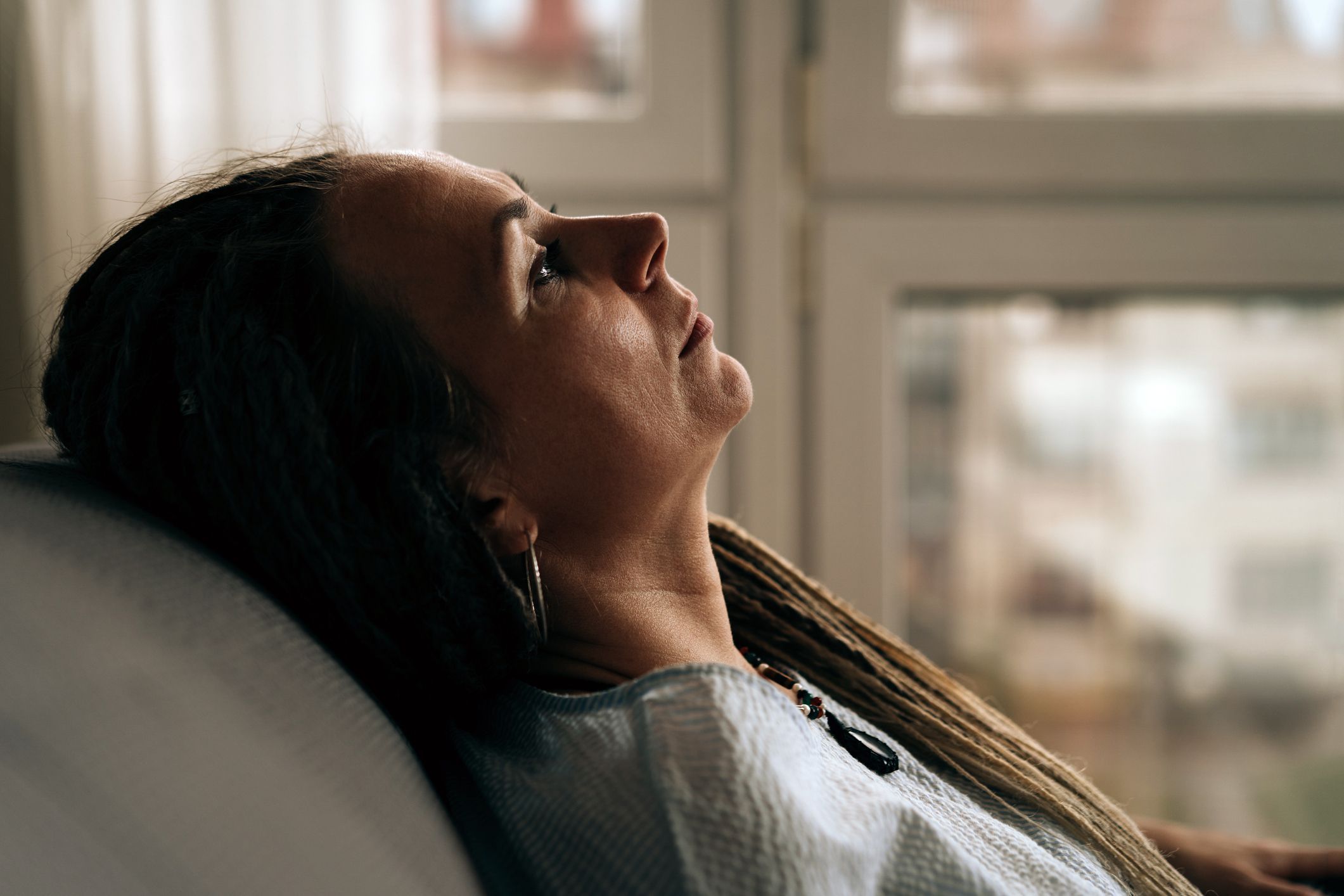 Portrait of a woman sitting on the sofa