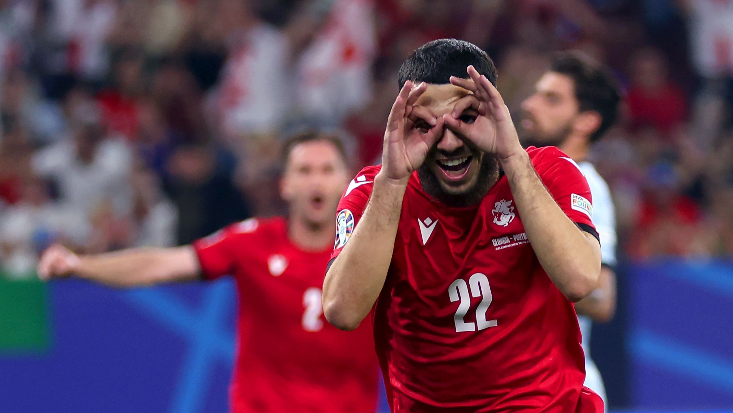 Georges Mikautadze comemora seu gol contra Portugal