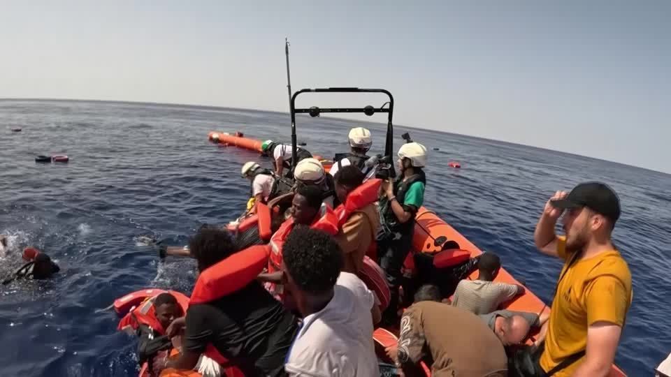 Dramatic video shows dozens of migrants rescued from overcrowded boat