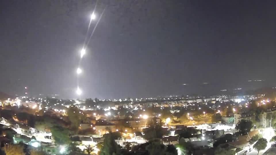 Flares and explosions light up northern Israel sky during rocket barrages from Lebanon