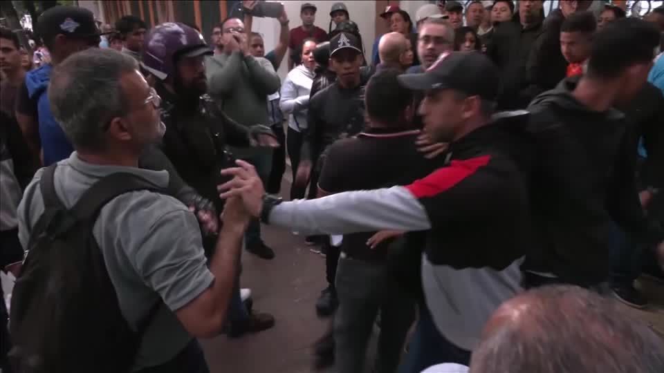 Venezuelan voters clash as they queue outside Caracas polling station