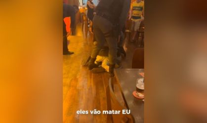 Funcionários públicos são presos durante abordagem à morador de rua em bar, em Cuiabá