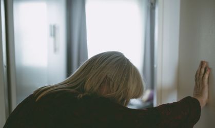 Elderly female suffering dizziness and fatigue at home