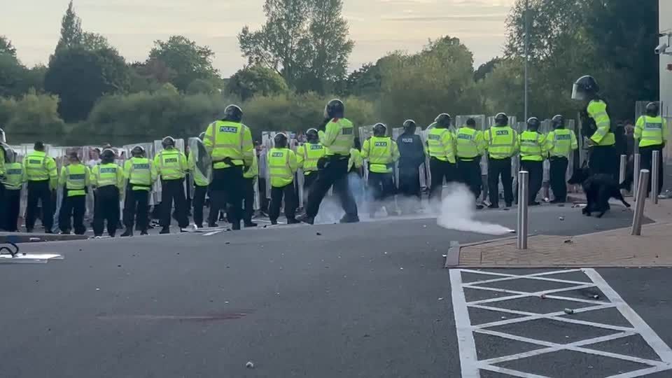 Anti-immigration protesters clash with police outside hotel housing migrants