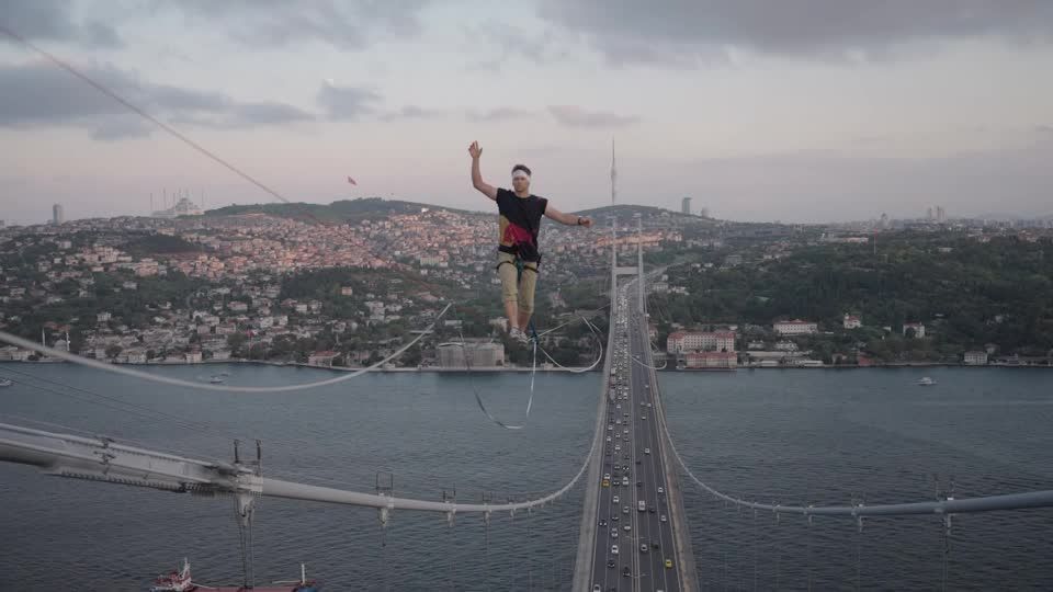Man crosses from Asia to Europe on slackline over Istanbul's Bosphorus Bridge