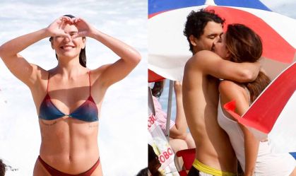 Mariana Goldfarb beija o namorado, Rafael Kemp, em praia do Rio